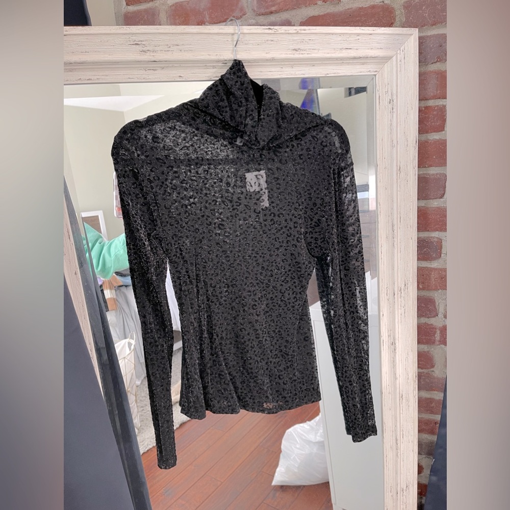 Sheer turtleneck cheetah top
